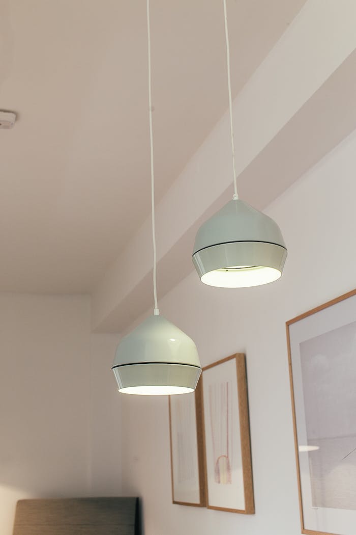 Lamps hanging from ceiling in room